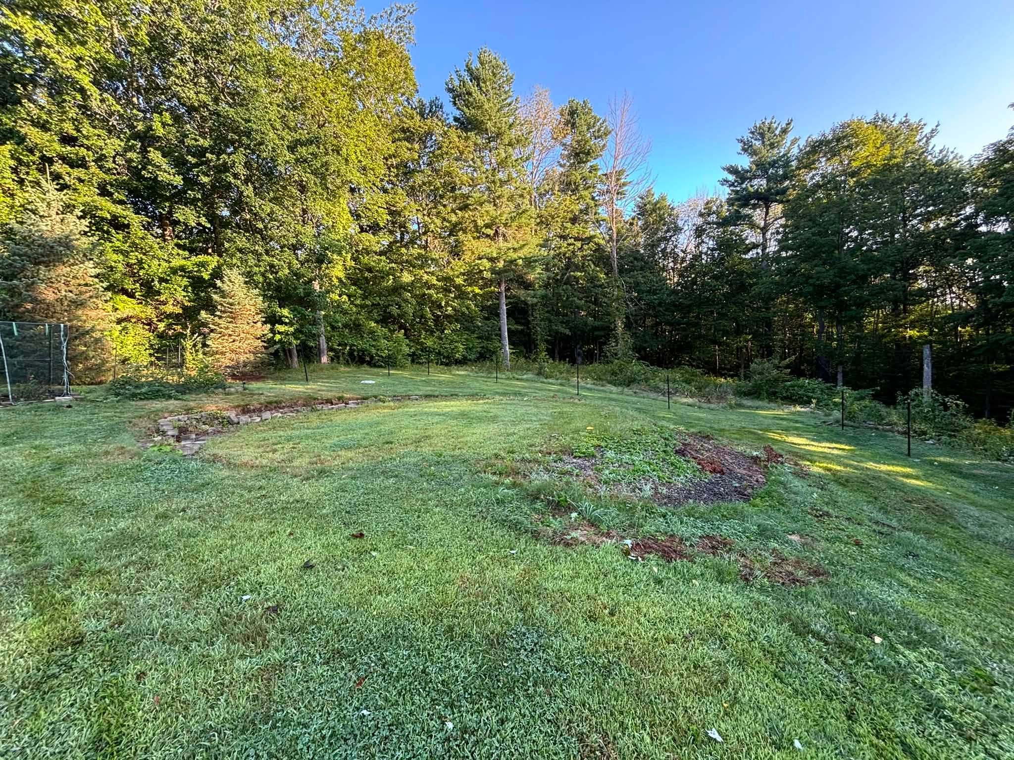 Existing yard conditions before regrading — Spencer, MA